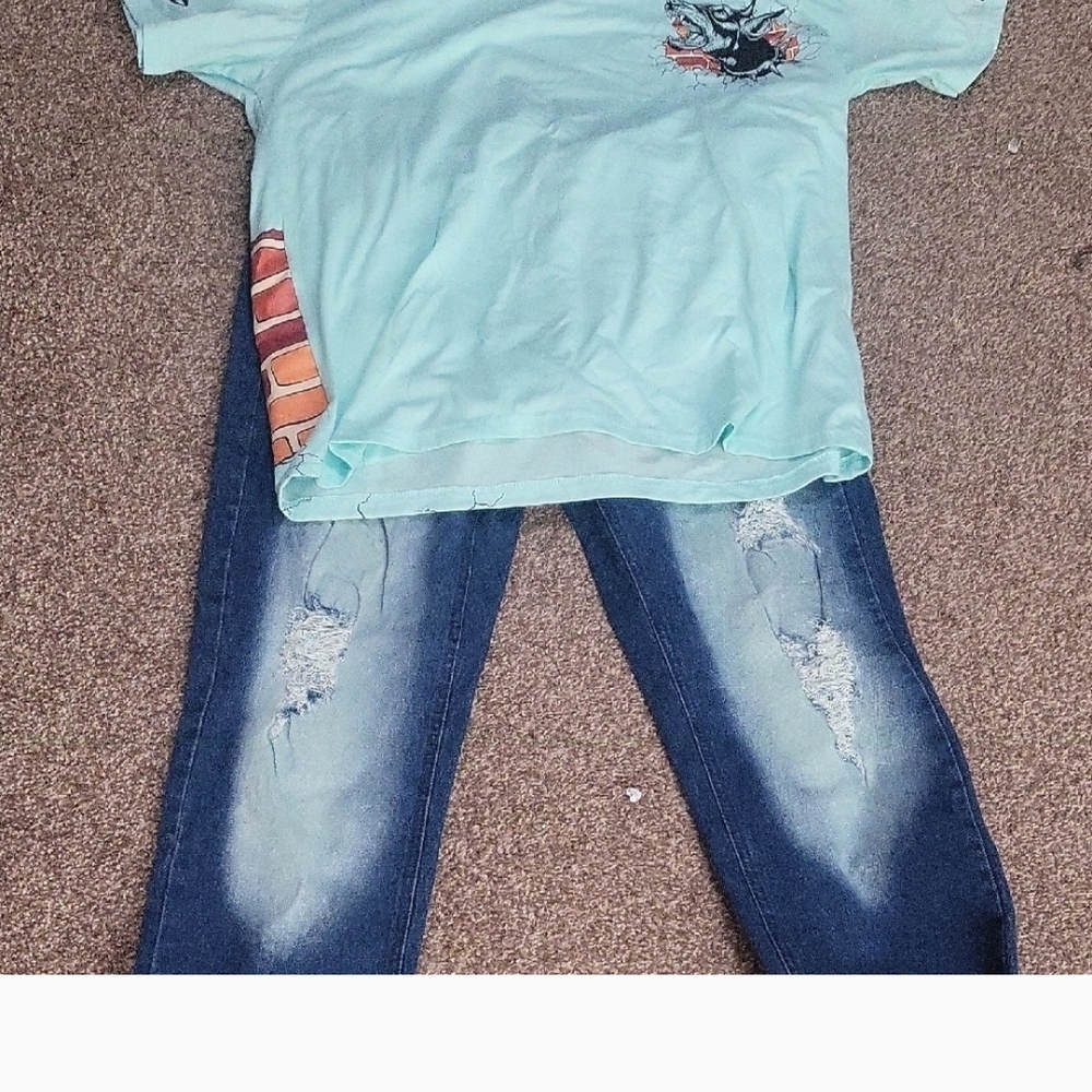 Light Blue Graphic T-Shirt and Distressed Jeans
